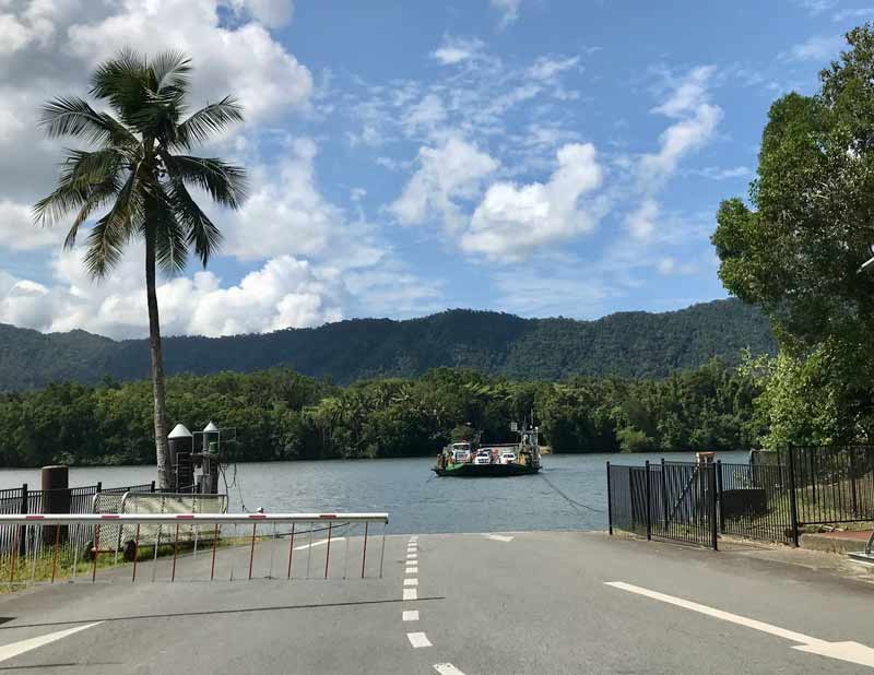 Road at Daintree River Edge with daintree river Car Ferry and Daintree Rainforest in the distance